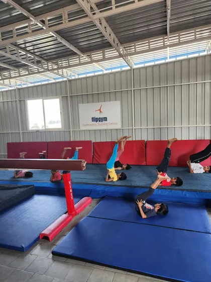 Students work on their shoulder stands and plow poses, an important drill for improving core strength and body control.