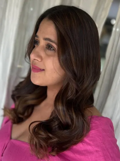 A side profile of the stunning caramel brown look, highlighting the soft waves and flattering tones.