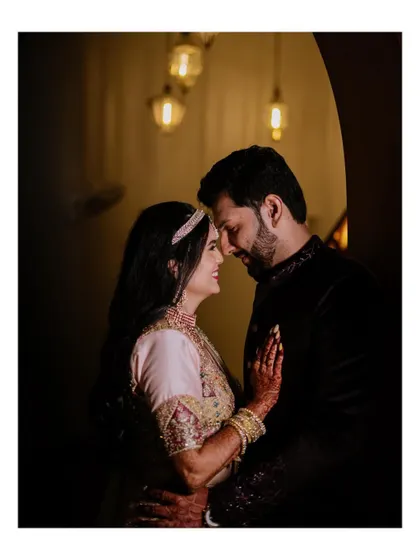 An intimate, softly lit portrait of the couple from their Sangeet.