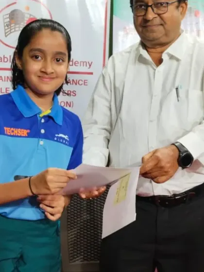 Yuktha Harsha receiving her certificate for securing 3rd place in the Under-13 girls category at the Belgaum state ranking tournament.
