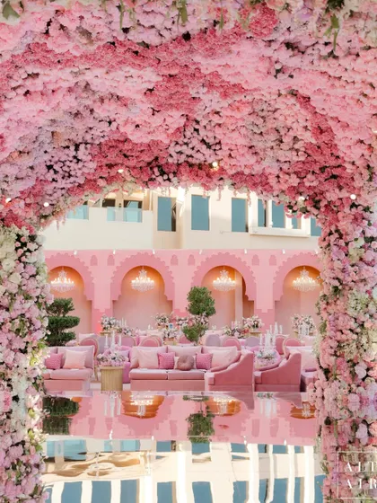 Another view of the 'Echoes of Pink' mandap and its reflection. The design aimed to create an atmosphere that intimately reflects the couple’s unique story, with every detail serving a purpose.