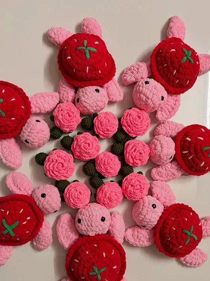A fun mix of my strawberry and rose turtle plushies. These colorful creations are great for imaginative play or as unique decorative pieces.