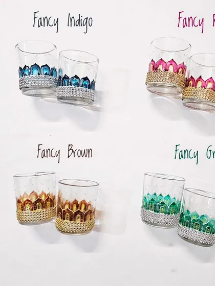 This image shows the 'Fancy' design for my tea light cups, available in four different color options: Indigo, Rose, Brown, and Green. Each pair is priced at Rs. 250.