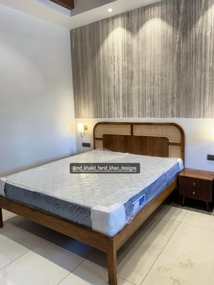 This image shows the bed and nightstand set against a textured wall, highlighting how my furniture complements various interior design styles.