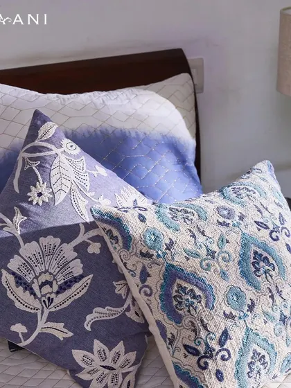 Each piece in my Indigo collection is a step towards a more serene and stylish living space. This close-up highlights the varied textures and patterns, from floral embroidery to tie-dye effects.