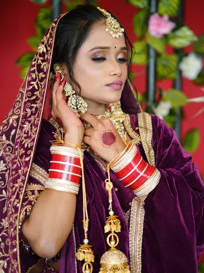 This pose highlights the complete styling, including the traditional chooda and kalire. As a makeup artist, understanding the entire cultural context is something I emphasize in my teaching.