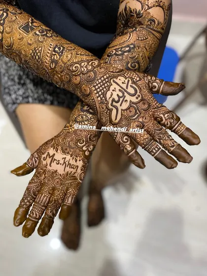 A lovely bridal design featuring 'Mrs. Khan' on one hand and the name 'Allah' in Arabic on the other, symbolizing blessings for the new journey.