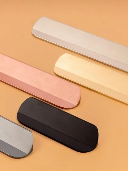 A set of minimalist, block-shaped hardware pieces in various finishes. This clean shot is perfect for architectural and interior design catalogs.
