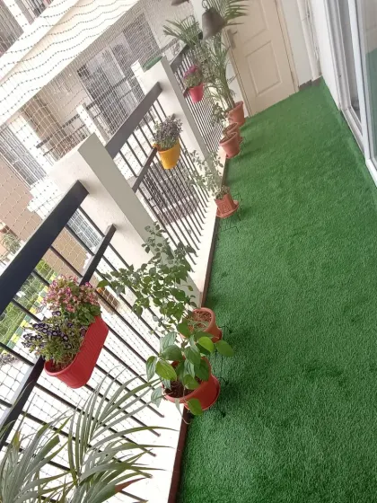 Another view of the finished balcony lawn, which is durable enough for furniture and foot traffic. The turf I use is safe for both children and pets.