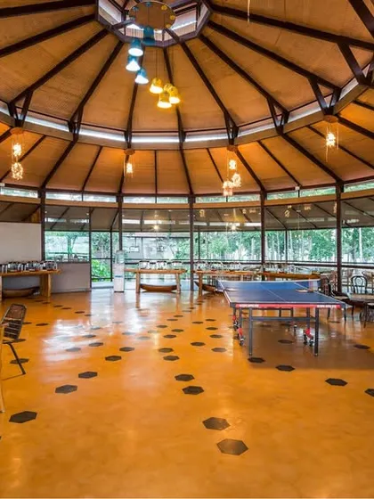 Our spacious, circular dining hall is more than just a place to eat. It's a community hub where guests can also play table tennis and socialize.