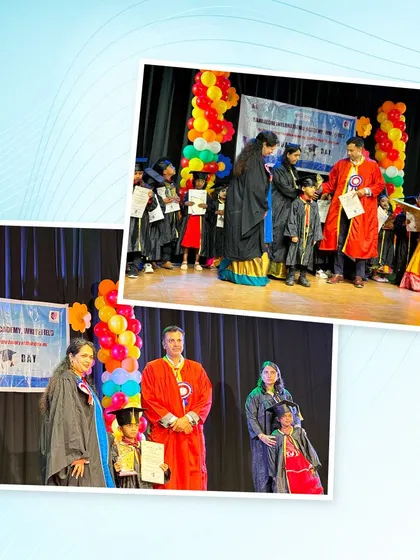 A preschooler receives his graduation certificate on stage, a proud moment for him and his family.
