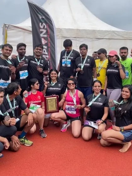 A big group photo celebrating our success at the Bengaluru Marathon. 15 PBs and 2 podiums, a truly exceptional day for the team.
