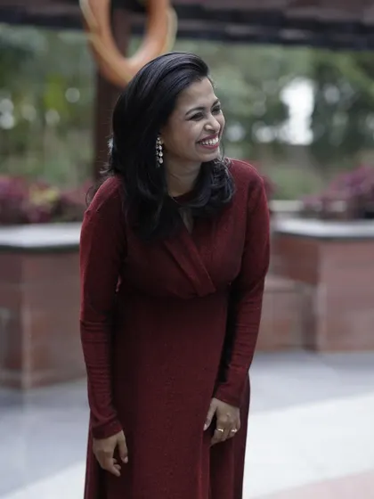 A candid shot of our happy client. It's wonderful to see the joy that the right outfit can bring.