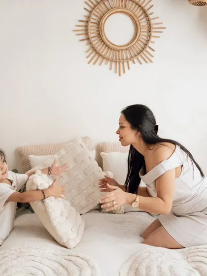A fun pillow fight between mother and son, showing how my studio sessions are all about capturing real play and connection.