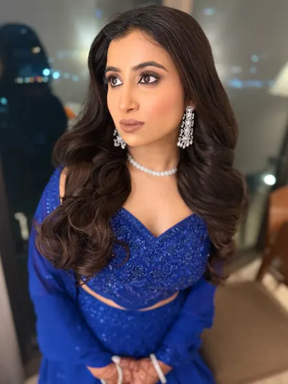Another shot of this dazzling look. The makeup is sharp and confident, perfect for a cocktail party or reception where you want to make a statement.