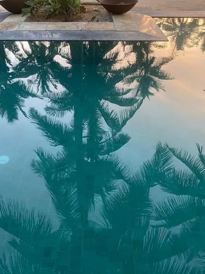 Another beautiful reflection in the pool at the Hassan farmhouse, capturing the serene atmosphere of the property.