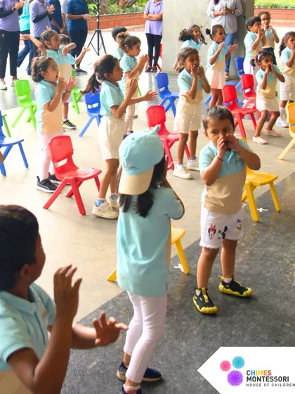 Children participate in warm-up drills, clapping and moving together in preparation for the day's events.