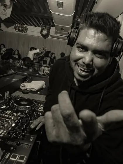 A black and white shot that captures the raw energy and connection with the crowd. It's all about the vibe.