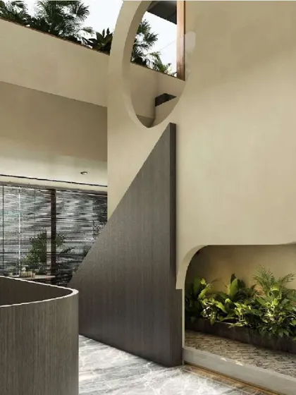 This villa transition zone embodies a zen-inspired tranquility. The fluidity of the curved walls is paired with a dry landscape bed, creating a sculptural and immersive experience where architecture and nature are in perfect harmony.