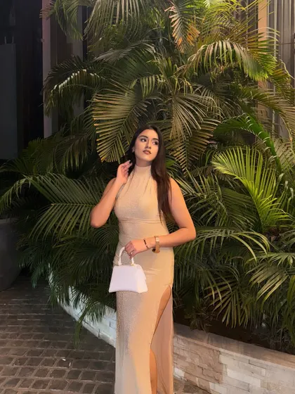 A full-length shot of the beige gown, perfect for a formal event.