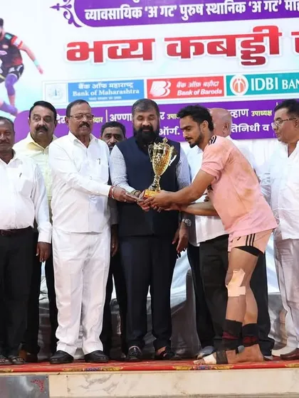 A player receiving the 'Best Player of the Tournament' trophy from officials.