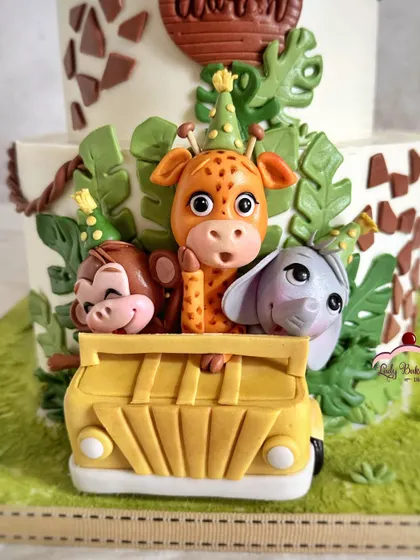 Look at these party animals! A close-up of the cheeky monkey, giraffe, and elephant peeking out of their safari jeep.
