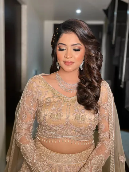 The eyes closed shot reveals the seamless blending and soft shimmer that defines this glamorous sangeet look.