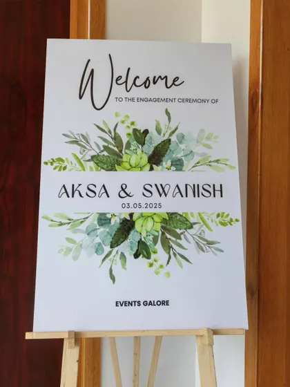 A simple and beautiful welcome sign with a watercolor greenery design, introducing guests to Aksa and Swanish's engagement ceremony.