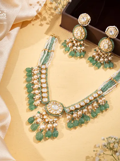 The Tourmaline Trail necklace, a gentle river of pastel green gemstones and soft pearls. This piece is for the woman who appreciates understated luxury and a poetic blend of color and craft.