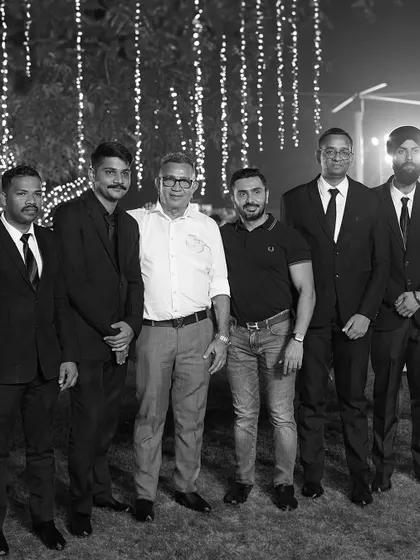A black and white version of our team photo, emphasizing the timeless values of unity and dedication that have been with our company for over 50 years.
