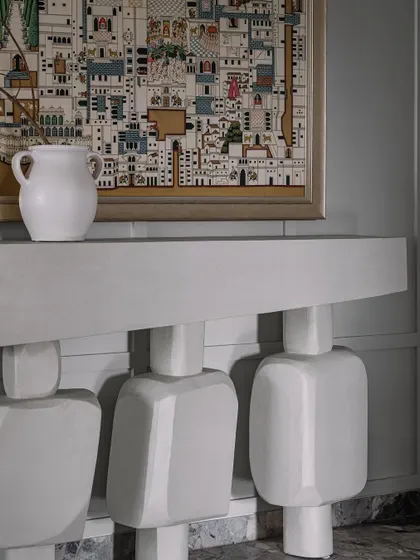 A detail shot from Frenchie Haus showing one of our custom console tables. The sculptural, geometric legs are a signature of our object design, turning a functional piece into a work of art.