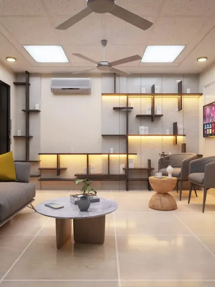 A comfortable and stylish waiting lounge for a commercial establishment. The design includes a mix of comfortable seating, ambient lighting from the shelving units, and a neutral color palette to create a calm and pleasant atmosphere for clients.