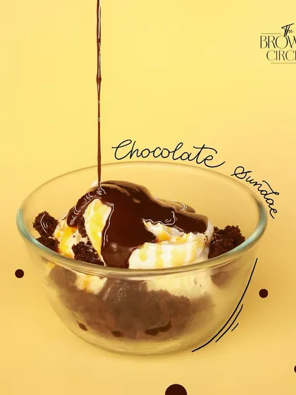 Scoops of heaven. Our Chocolate Sundae is a classic dessert, featuring brownie chunks, ice cream, and a rich chocolate sauce.