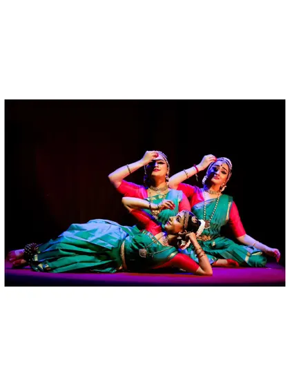 A moment of repose and grace from "Tyagaraja Hrt Sadhana." Even in stillness, the dancers continue to convey emotion and story, a crucial aspect of abhinaya.