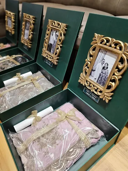 I love shaping your ideas into reality. For these wedding hampers, I created custom emerald green boxes with personalized photo frames and acrylic name tags, making them super chic, classy, and elegant.