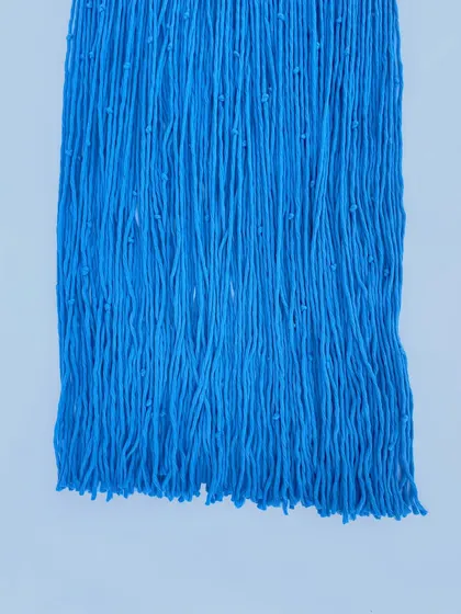 Here you can see the texture and detail of the premium cotton yarn used in our tapestries. The small, intentional knots within the threads add depth and a handmade quality that distinguishes our pieces.