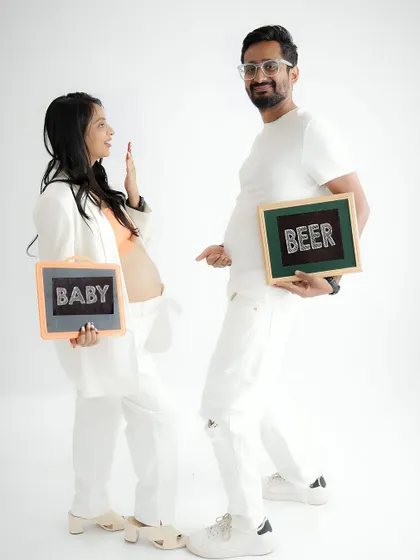 A little bit of humor for the journey. This playful shot with "Baby" and "Beer" signs is a fun way to capture your personalities and the changes ahead.