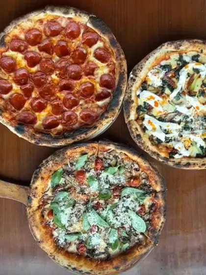 A trio of our wood-fired bestsellers. From classic pepperoni to gourmet vegetarian options, our pizzas are designed to be the centerpiece of your celebration, each with a perfectly charred Neapolitan crust.