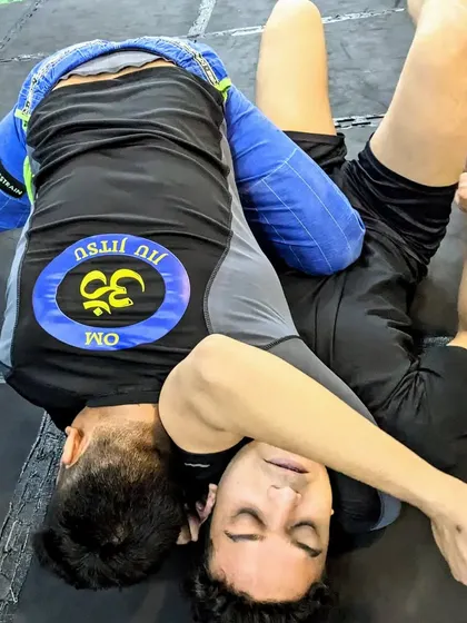 The effectiveness of a technique depends on practice, not just power. Here, a student works on a triangle choke, perfecting the mechanics to make it efficient and tight.