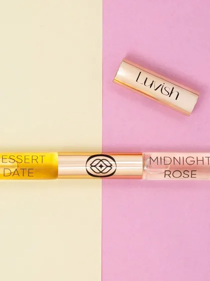 A simple and sweet composition for another dual ended perfume. The pastel yellow and pink split background creates a soft and feminine look, highlighting the product's dual fragrances.