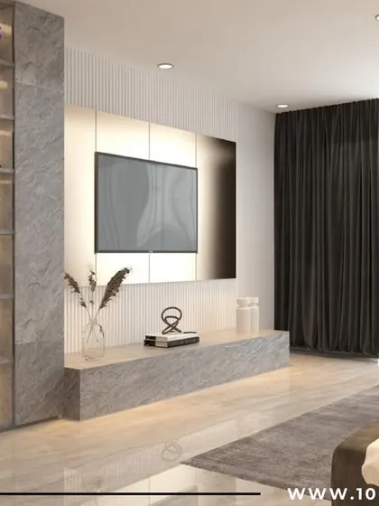 A minimalist TV unit in stone finish with an integrated display tower, creating a sleek and modern entertainment hub.