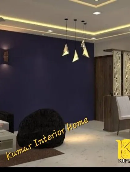 This image shows the living area with a dark accent wall and modern pendant lights, creating a dramatic and cozy atmosphere.