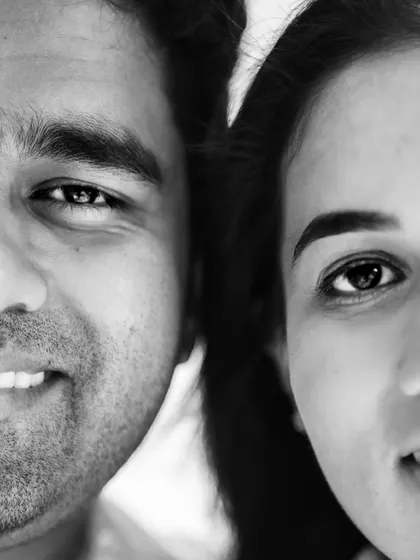 An extreme close up in black and white, focusing on the eyes and smiles. This style of portrait is incredibly intimate and powerful, revealing a deep connection.
