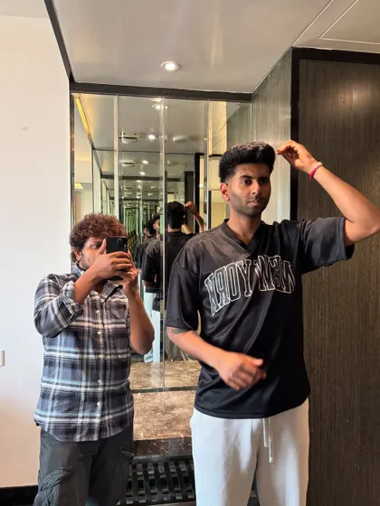 Capturing the process of styling Mayank Yadav's hair.