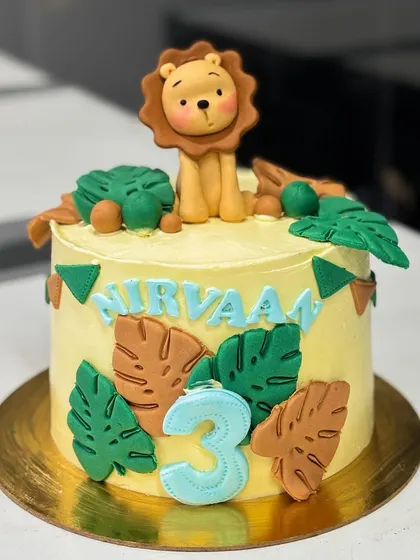 Another angle of the Nirvaan's jungle birthday cake, highlighting the custom details.