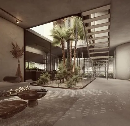 The entrance foyer of the House of Veils opens into a large living space centered around an internal courtyard. The design uses solid, flowing walls and filtered light to create a sense of unveiling and discovery as you move through the home.