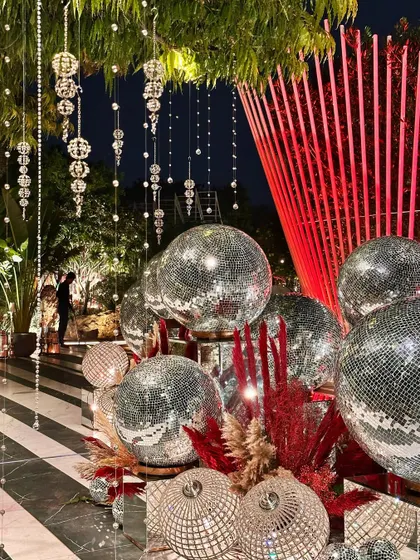 Another angle of the disco ball and crystal installation, reflecting light and creating a party-ready atmosphere.