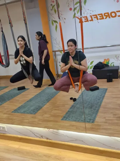 A moment of calm and focus in our aerial class. Using the hammock as a seat, we practice grounding and centering poses that prepare the mind and body for more dynamic movements.