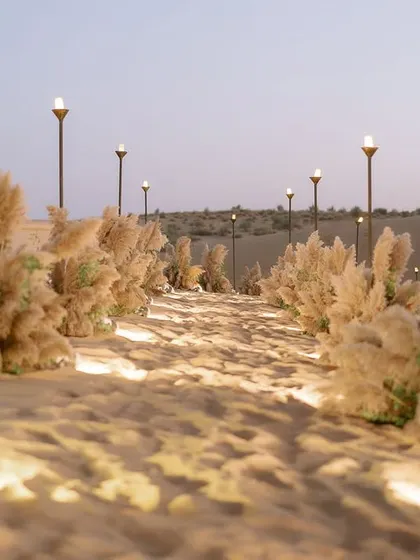 A welcome party in the middle of the breathtaking Thar desert. We let the epic landscape take center stage, using an earthy, neutral palette and soft lighting to complement the natural beauty of the dunes.