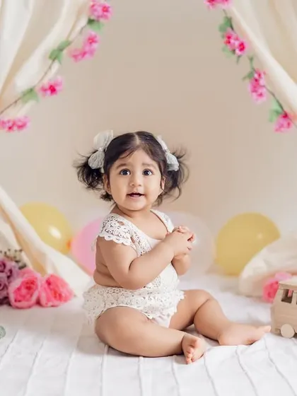 An adorable, curious expression from the birthday girl. These milestone sessions are designed to be comfortable and fun, allowing me to capture a variety of natural and sweet moments.